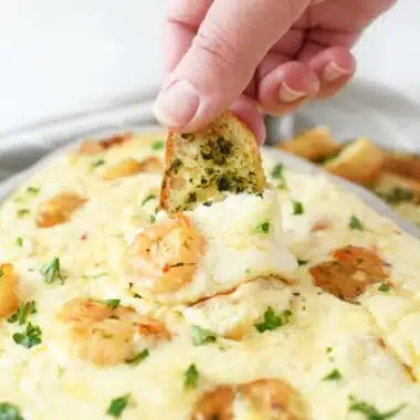 Cheesy Shrimp scampi on an herbed crostini.