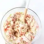 Zesty Seafood Salad in a bowl with a spoon.