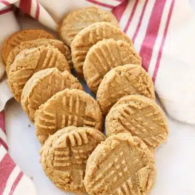 3 ingredient peanut butter cookies on a white table with a napkin.
