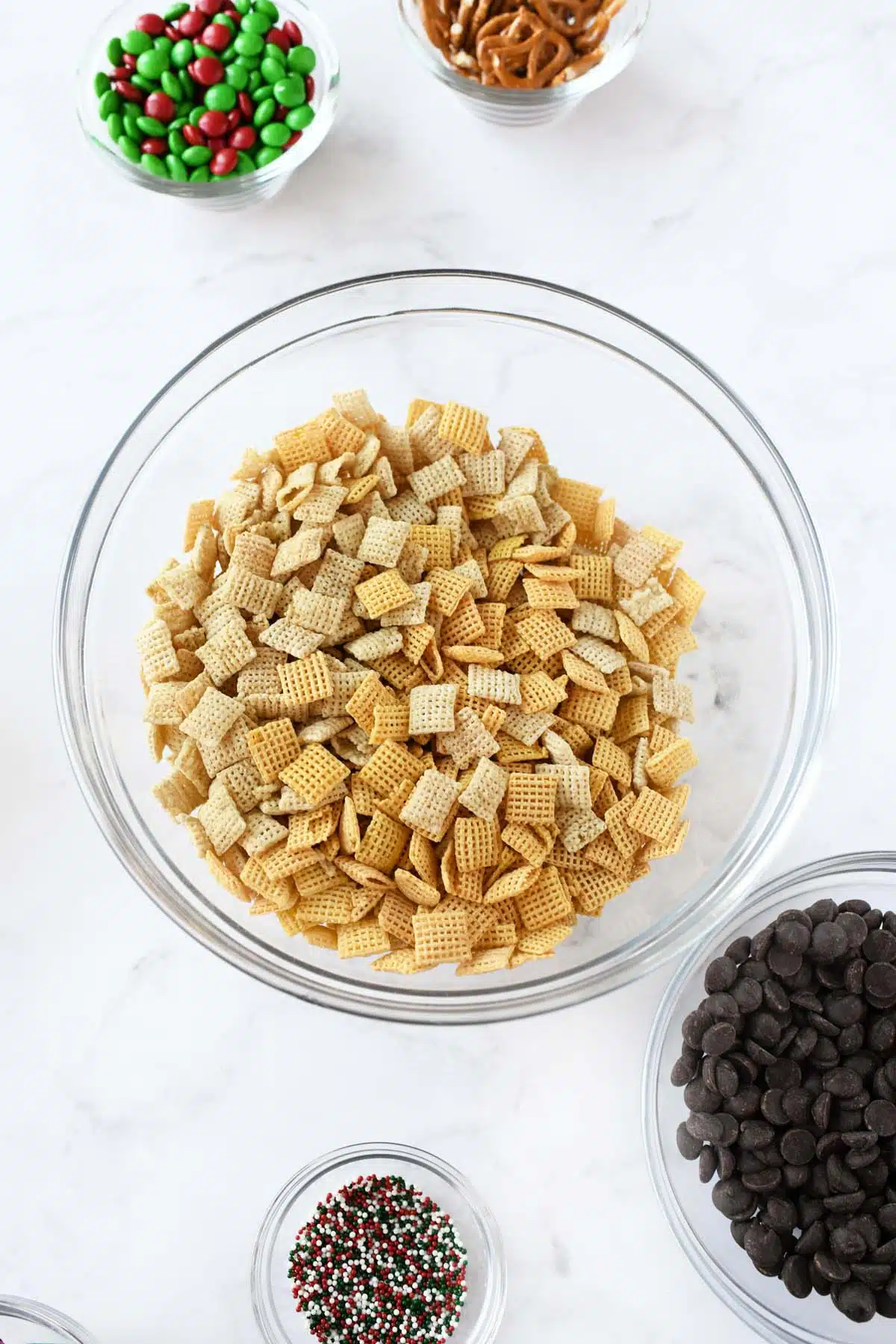 Chex cereal in a large glass bowl.