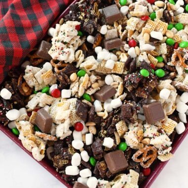 Elf Munch Chex Snack mix on a sheet pan.