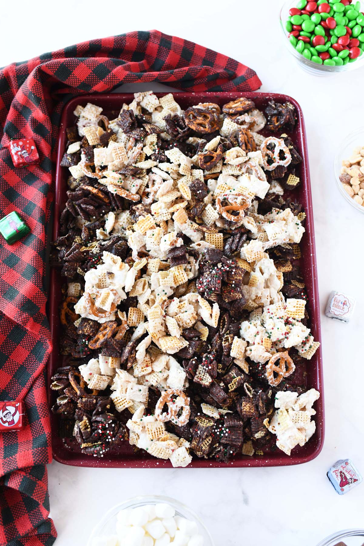 Tuxedo Chex mix in a large baking sheet.