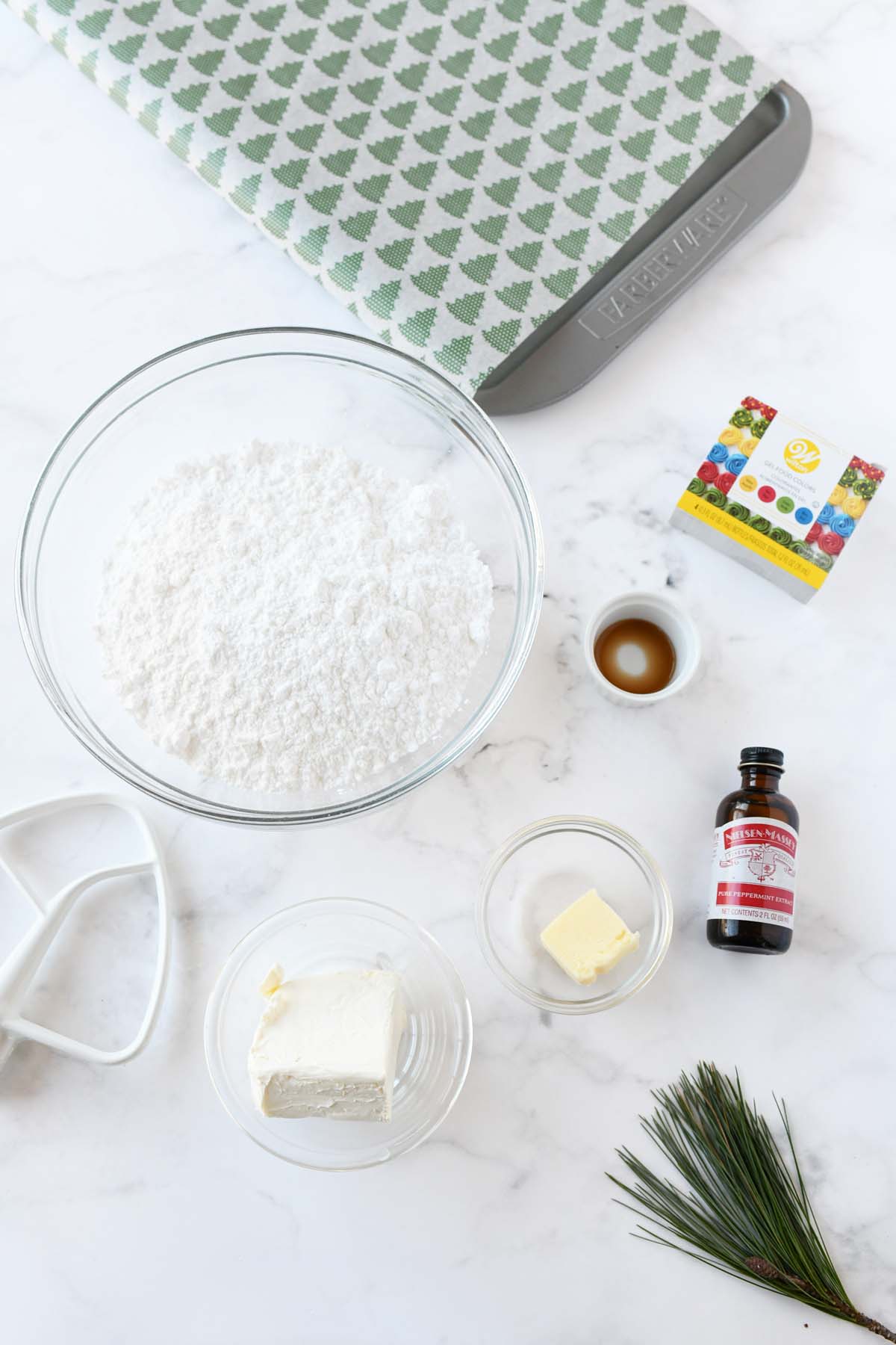 Cream cheese mint ingredients on a white marble table.