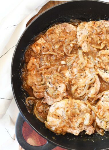French onion pork chops in a skillet.
