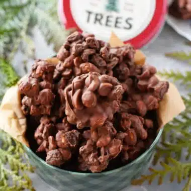 Raisin and Peanut Chewy Clusters in a small, green Christmas tin.