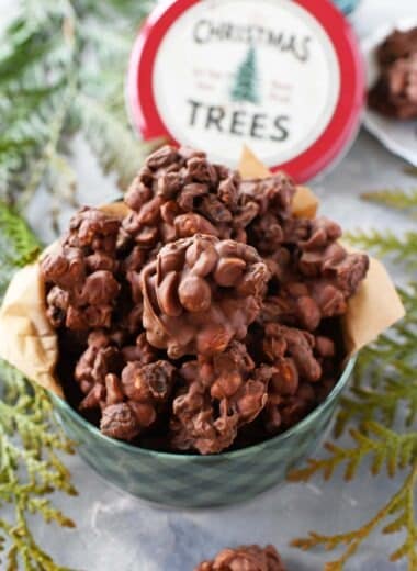 Raisin and Peanut Chewy Clusters in a small, green Christmas tin.