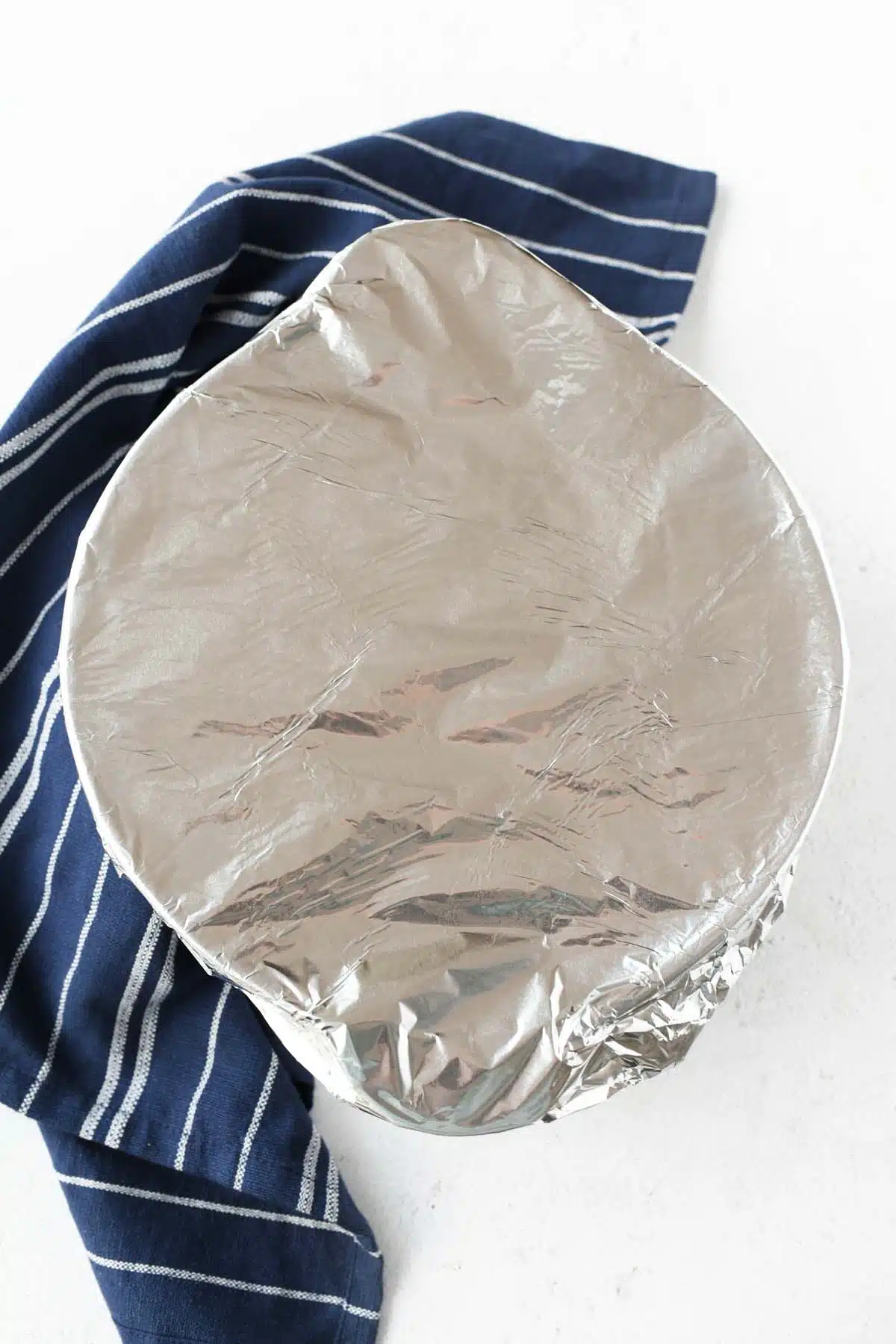 Covered rice pudding with aluminum foil.
