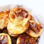 Bacon, egg, and cheese bite with a bite taken out of it.