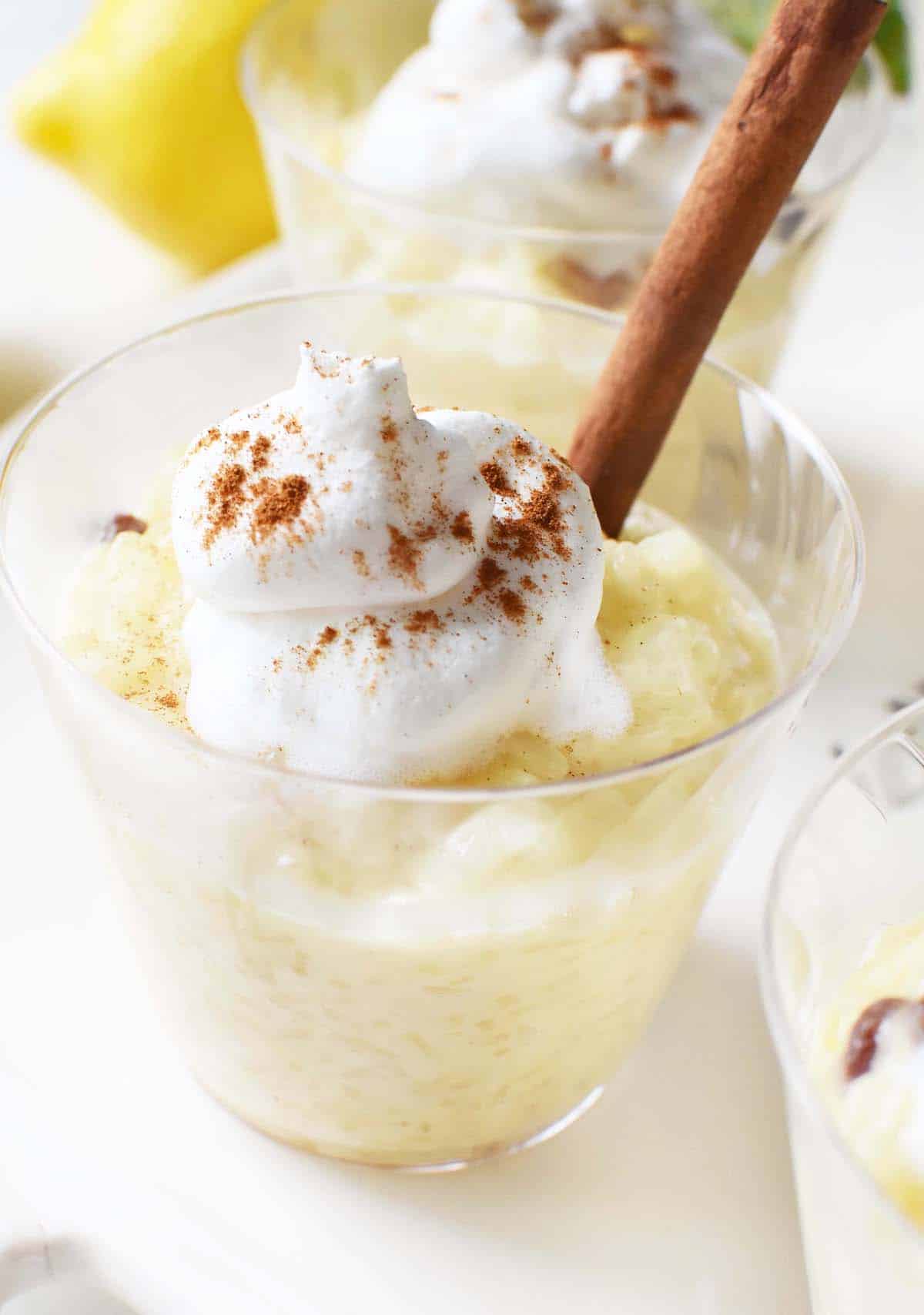 Lemon Rice Pudding with Cinnamon Sticks and whipped cream.