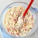 Sweet Macaroni Salad in a bowl with a red spoon.