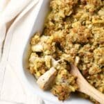 A wooden spoon in chicken casserole.
