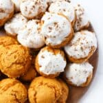 Fluffy iced Pumpkin spice cake mix cookies on a tray.