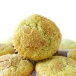 A fluffy pistachio muffin stacked.