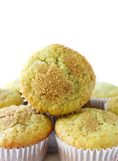 A fluffy pistachio muffin stacked.