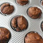 Fluffy pumpkin muffins in a cupcake pan.