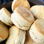 A cast iron skillet filled with fluffy 2-ingredient biscuits.