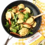 Peanut Sauce cheese ravioli stir-fry in a black skillet.