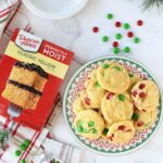 Christmas Cake Mix Cookies with red, and green M&Ms and a cake mix box.