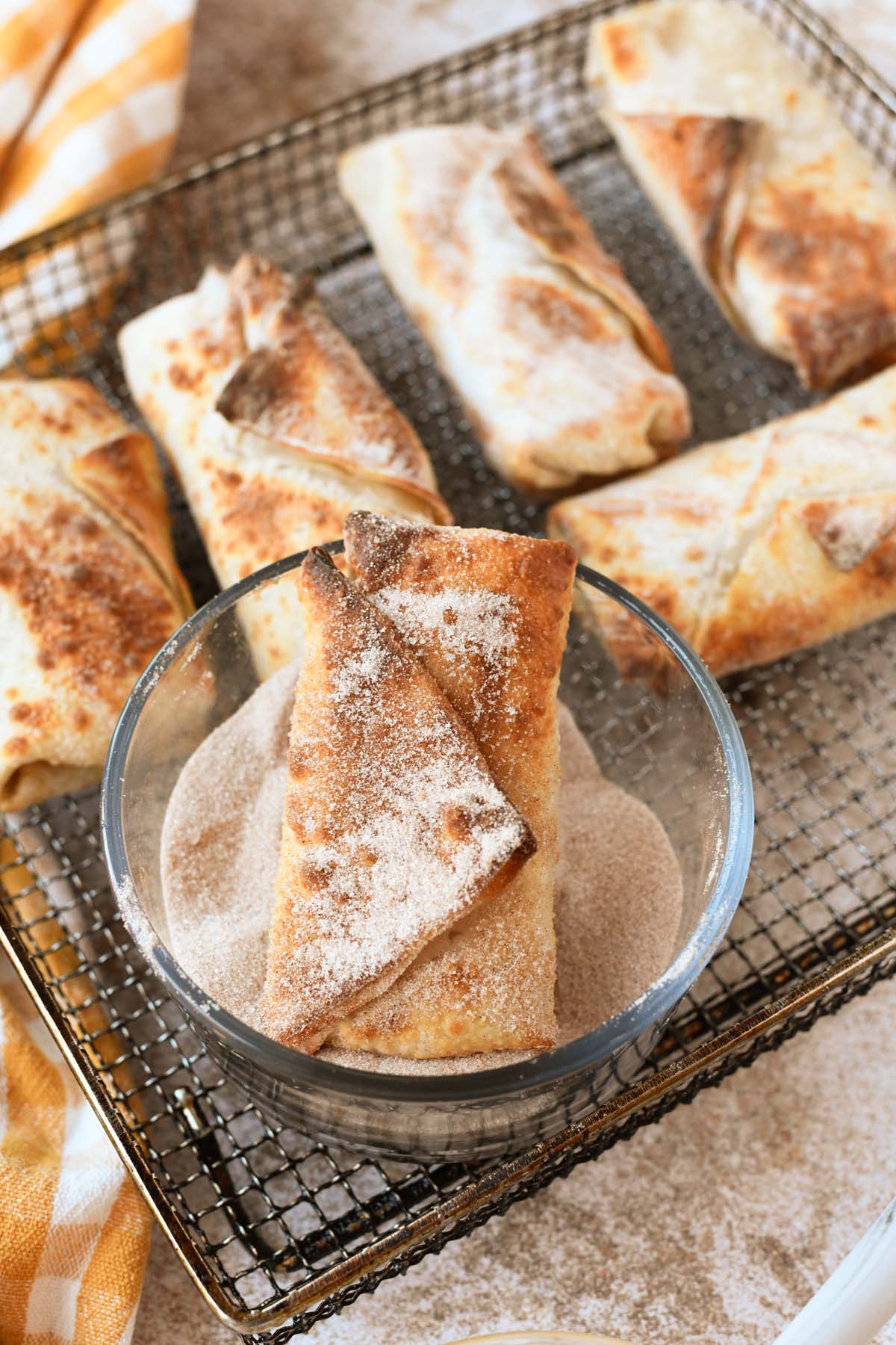 An air fried apple pie egg roll with cinnamon and sugar.