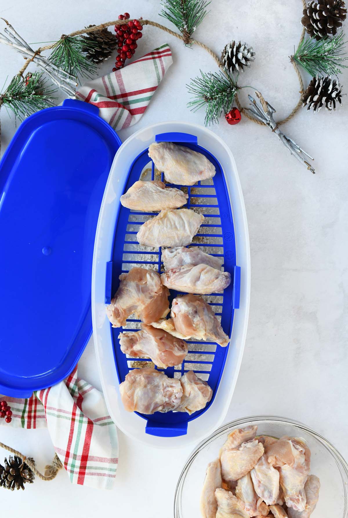 Wings in  blue, plastic Better Breader XL container.