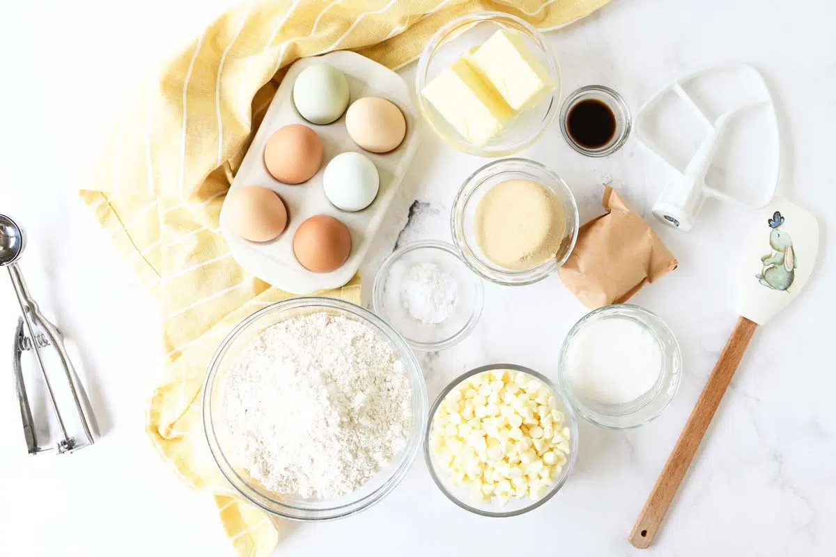 Banana pudding cookie ingredients on a white table with a yellow napkin.