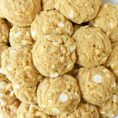 Banana white chocolate chip pudding cookies on a white plate.
