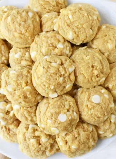 Banana white chocolate chip pudding cookies on a white plate.