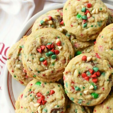 A plate of red, and green chocolate chip Christmas cookies.