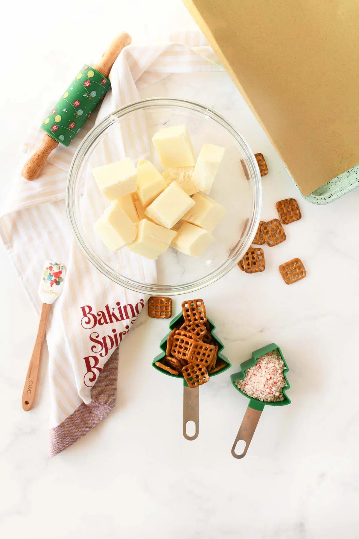 A white table with peppermint pretzel bark on top.