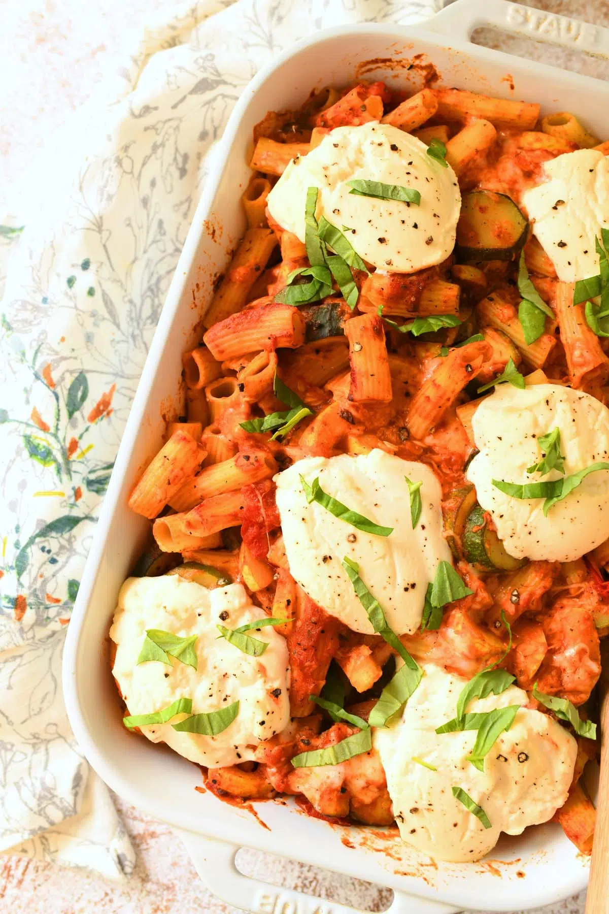 Baked Ziti with basil on top up close shot.