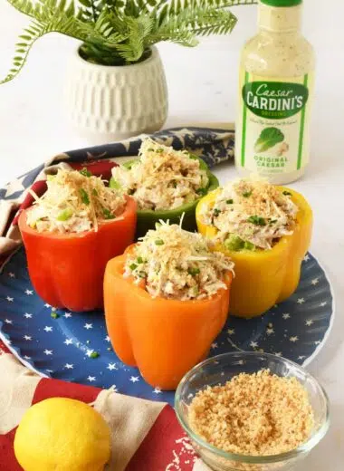Rainbow stufed peppers with chicken salad on a blue, star plate.