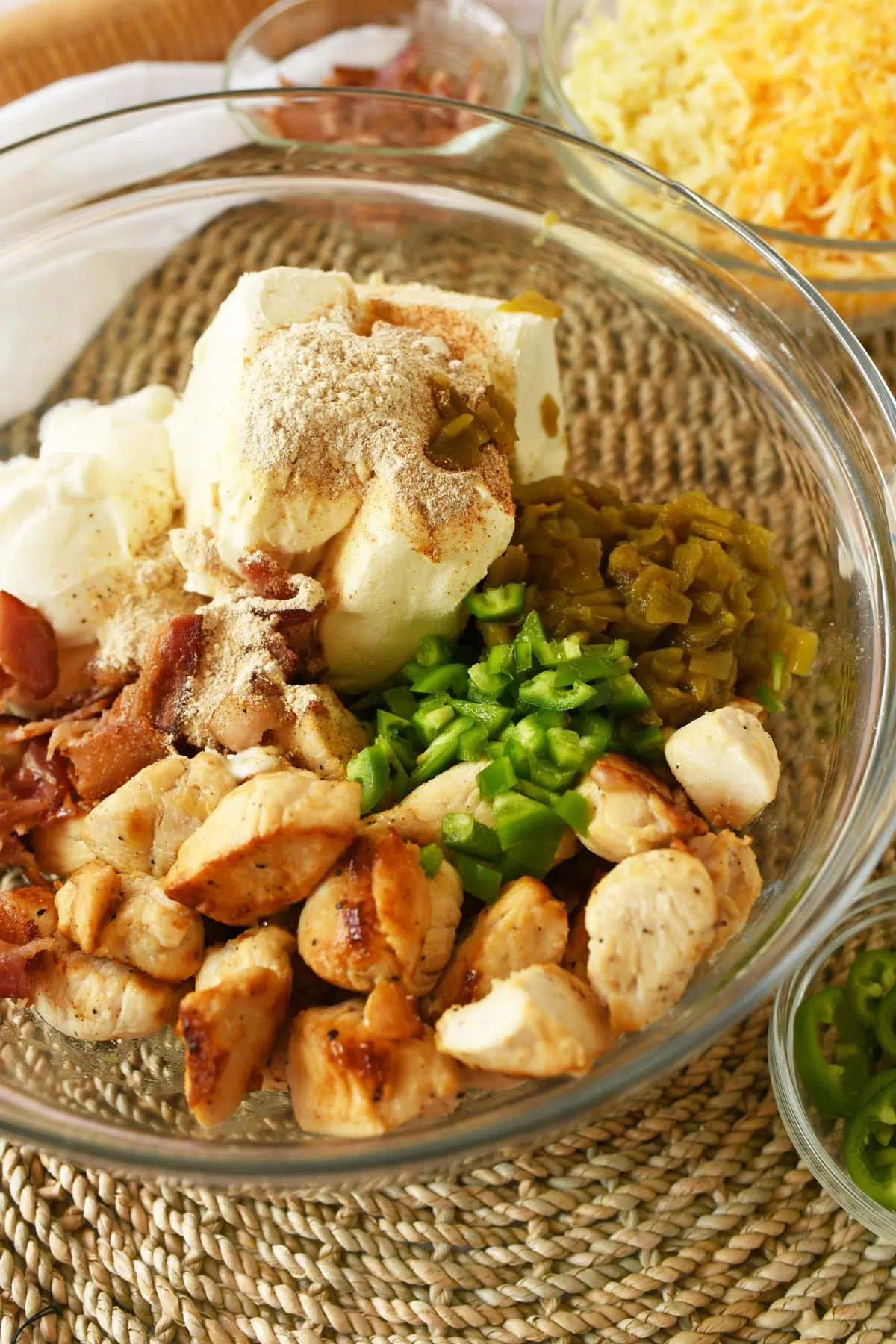 Jalapeno popper chicken ingredients in a glass bowl.
