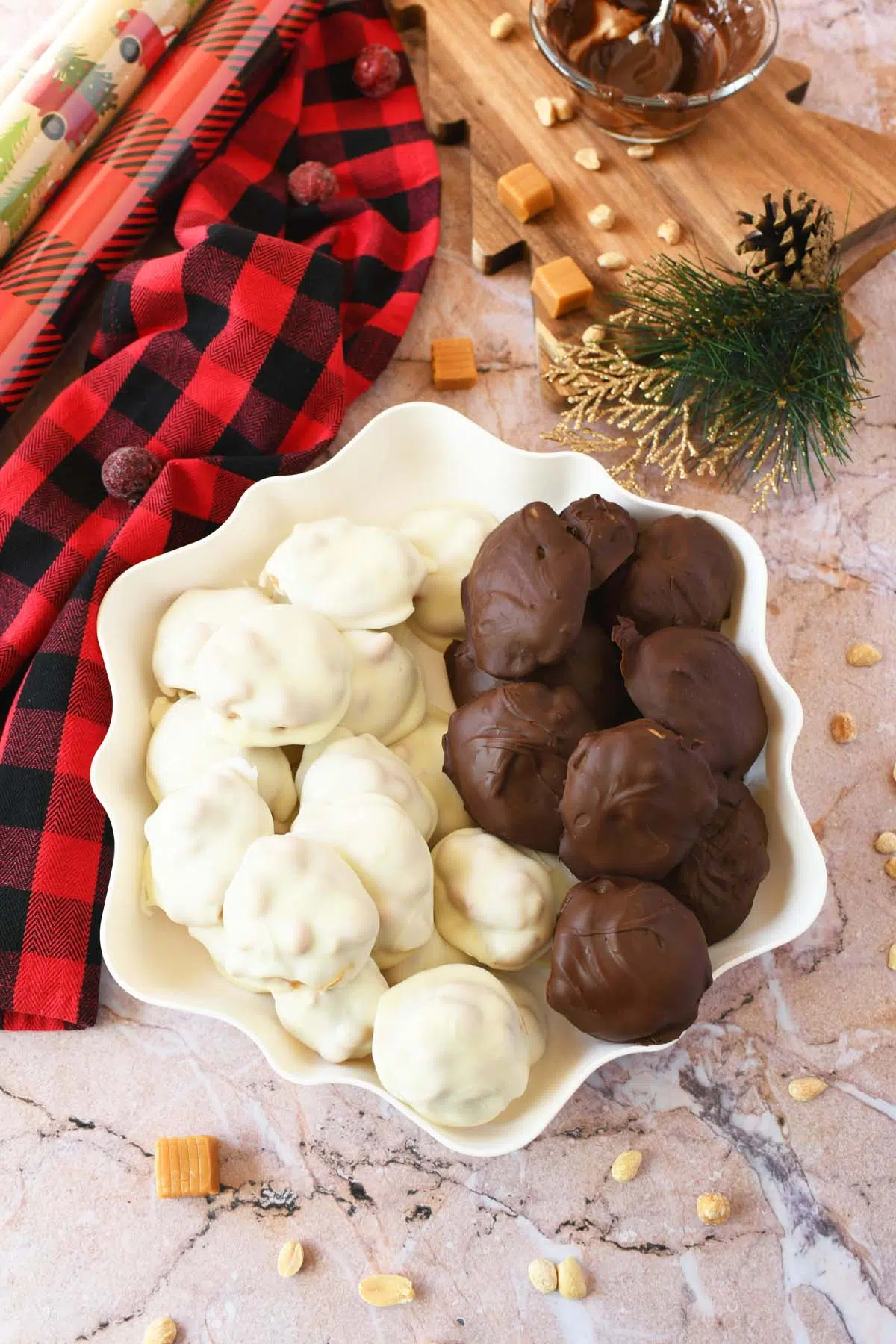 White, and semi-sweet bear paw candies on a white platter with holiday accents nearby.
