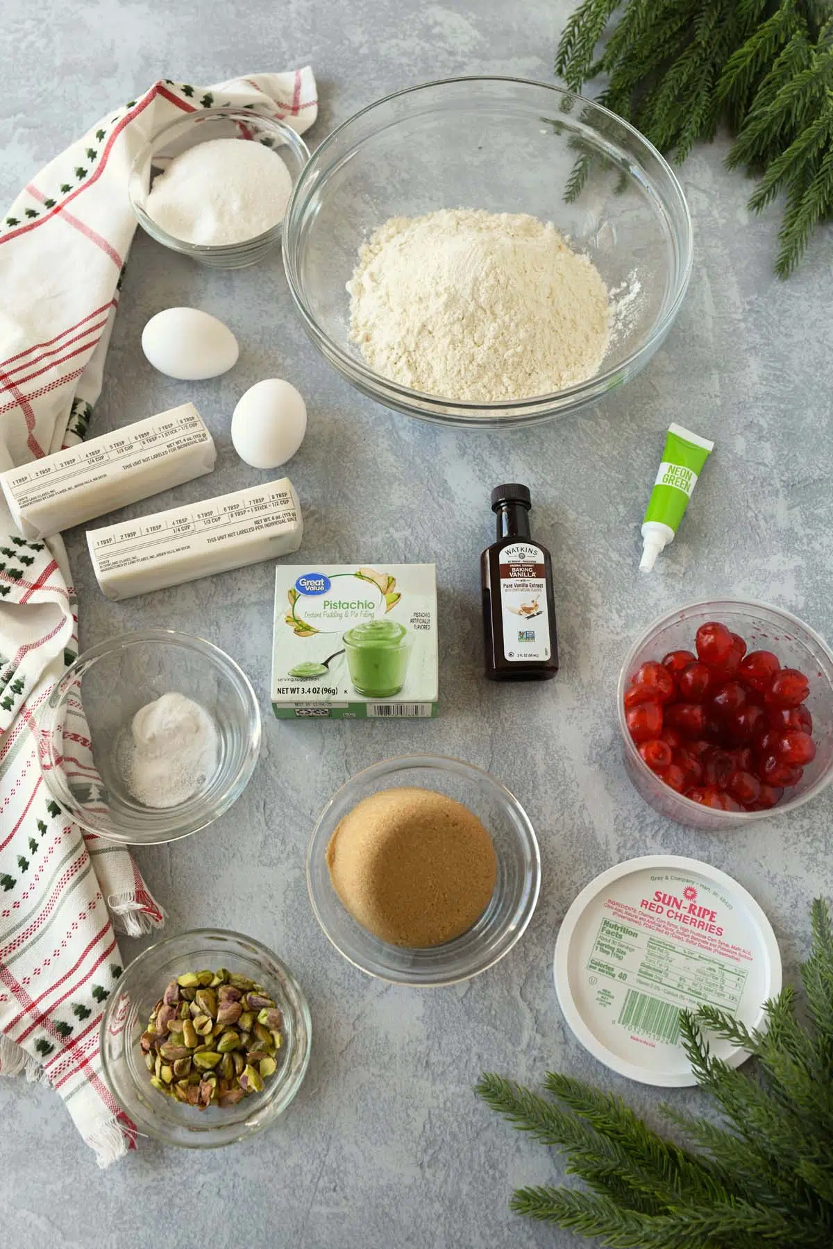 Pistachio cherry cookies ingredients on a stone table.
