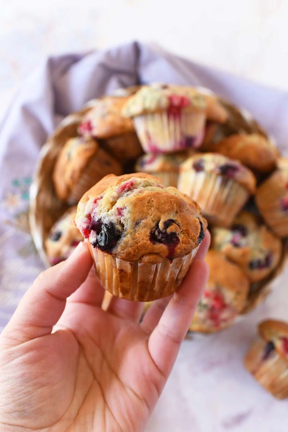 Blueberry Raspberry sourdough muffin in hand.