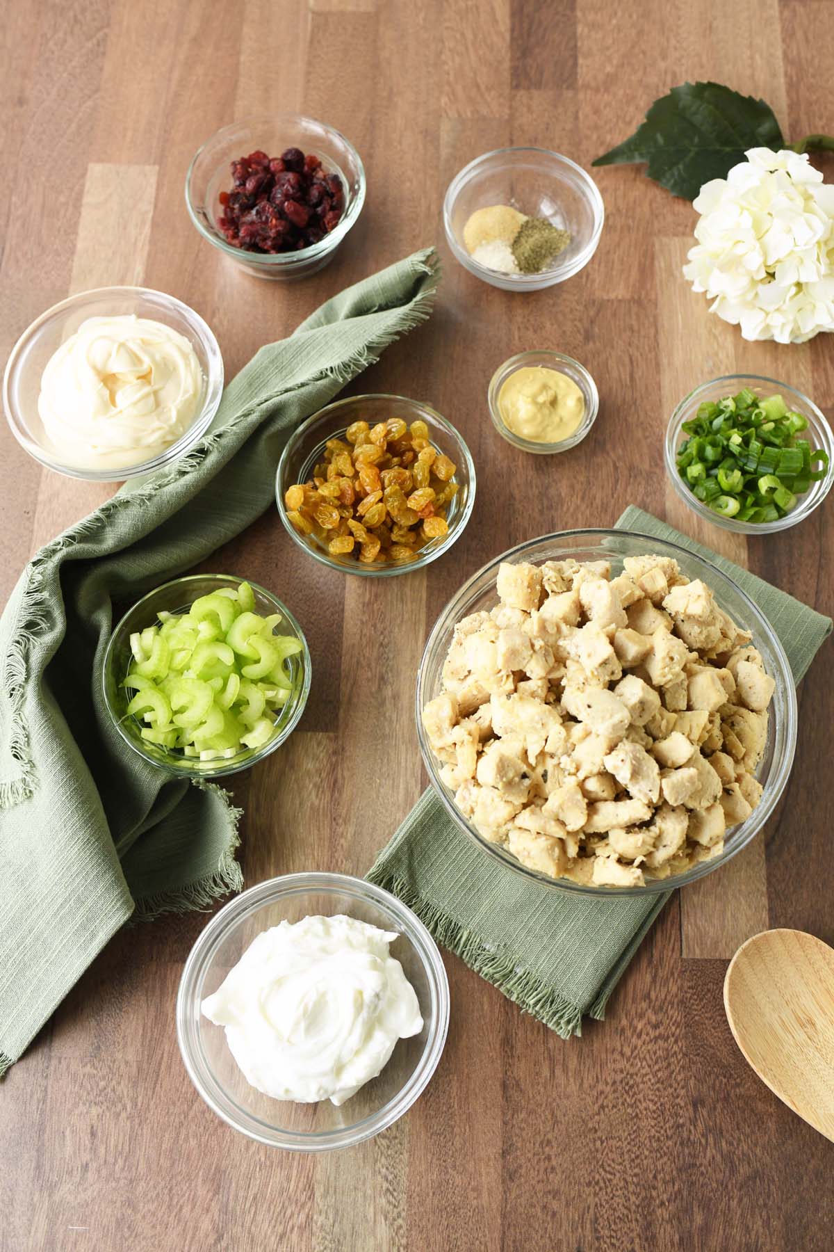 Pan-Seared Harvest chicken salad ingredients on a wooden table.