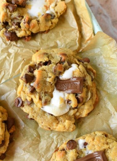 Oeey, Gooey, S'mores jumbo cookies on a parchment-lined baking sheet.